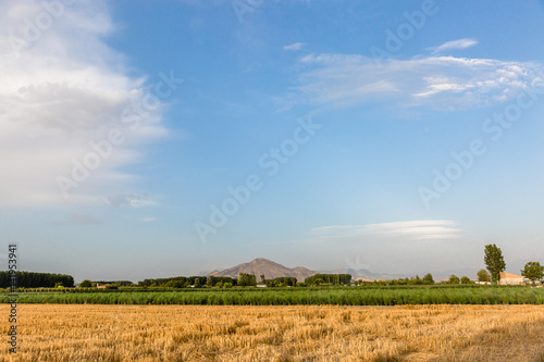 Landscape with view of sky and mountains in the background