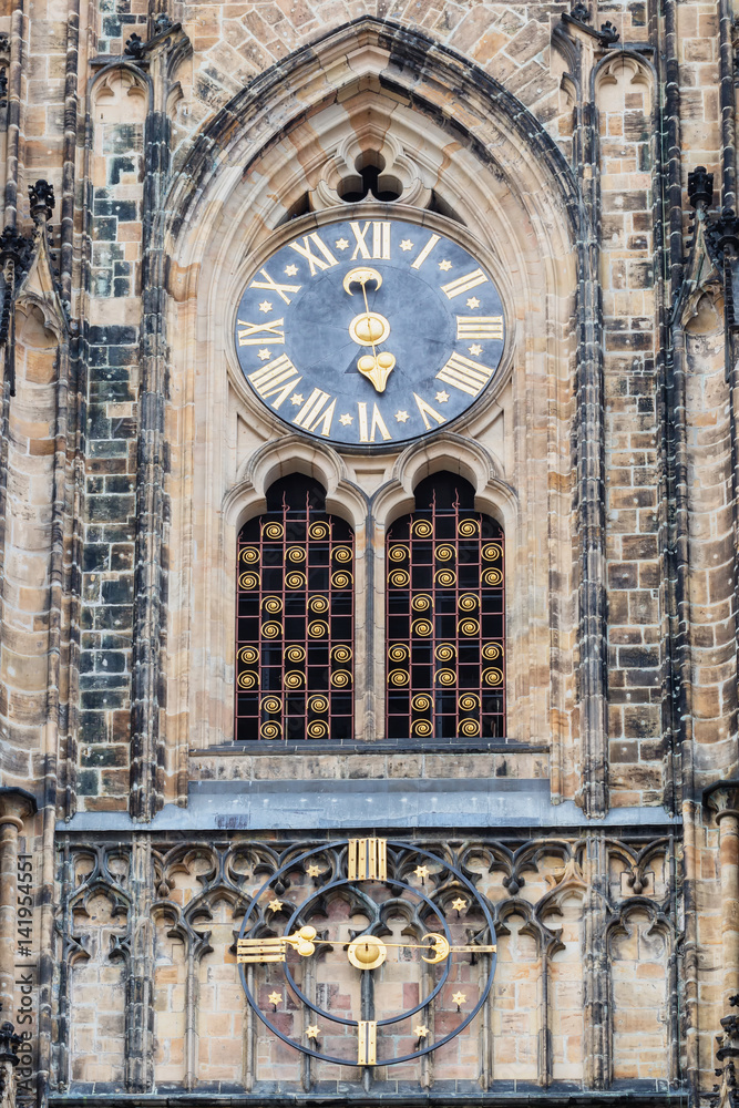 Astronomical Clock and gate of the Gothic Cathedral of Saints Vitus, Prague Castle, Czech Republic Europe.