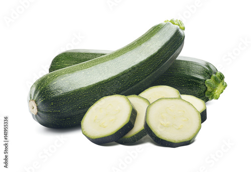 Zucchini whole round pieces isolated on white background