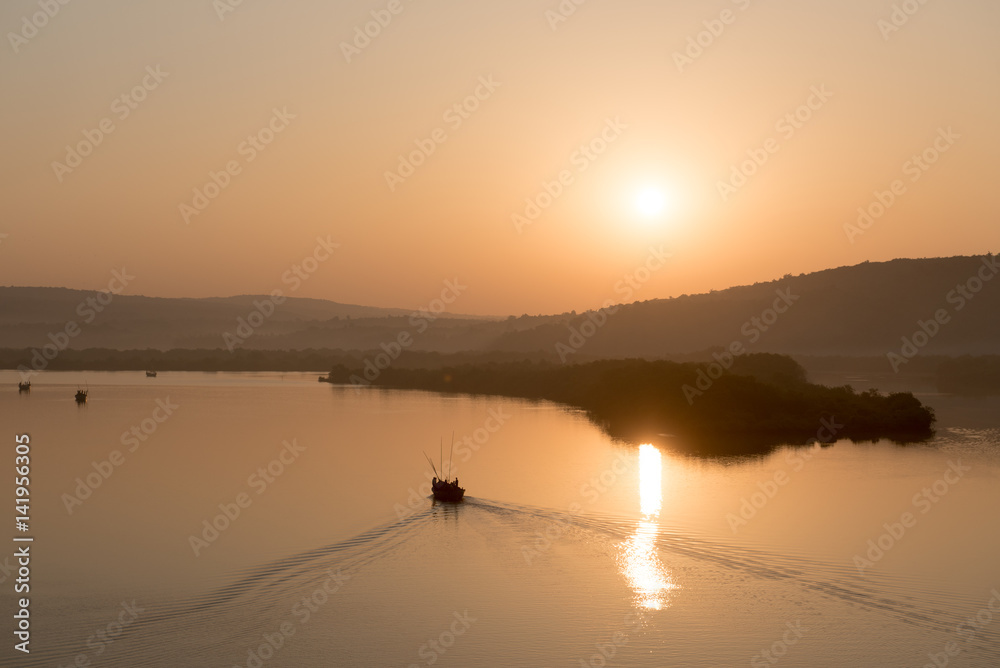 Fototapeta premium Tropical sunrise over misty river