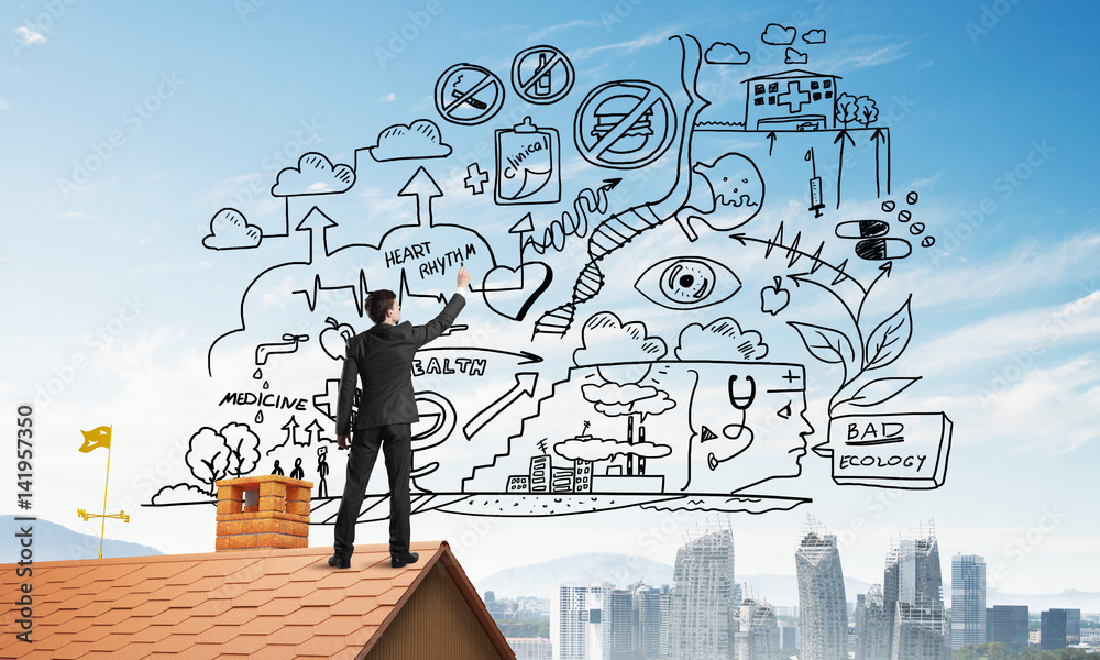 Rear view of businessman on house roof drawing his new business strategy. Mixed media Rear view of businessman on house roof drawing his new business strategy. Mixed media