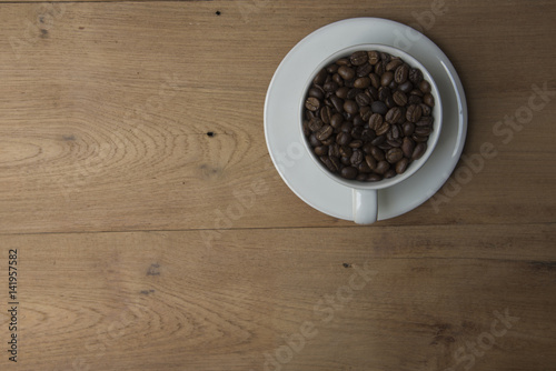 Coffee cup top view on wooden table background