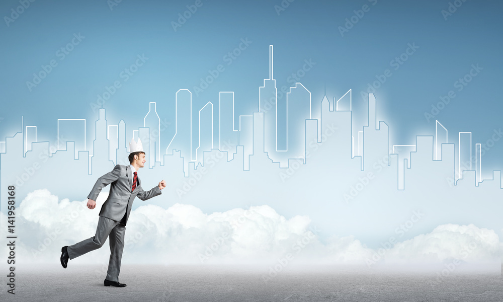 King businessman in elegant suit running and blue cityscape silhouette at background King businessman in elegant suit running and blue cityscape silhouette at background
