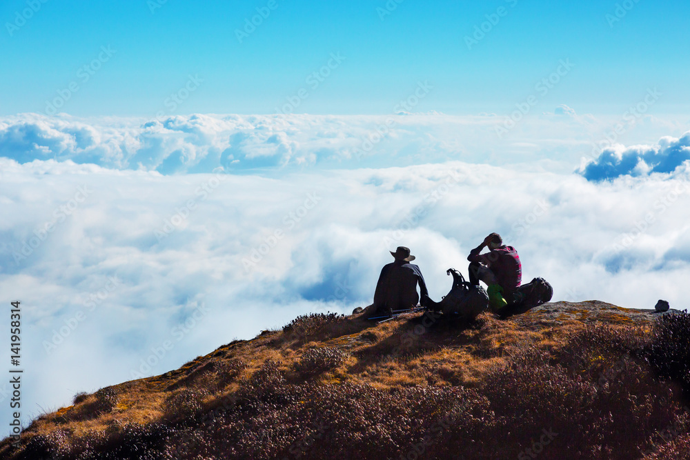 People relaxing on Mountain Cliff enjoying cloud Sky Horizon