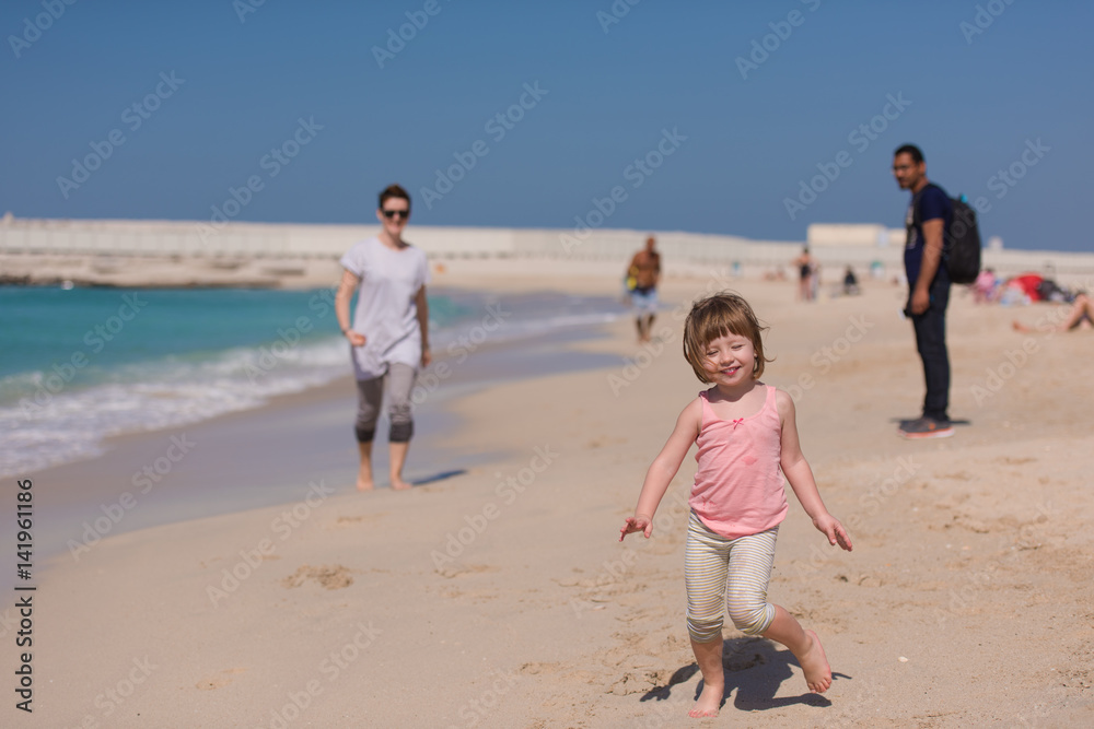 mother and daughter running on the beach mother and daughter running on the beach