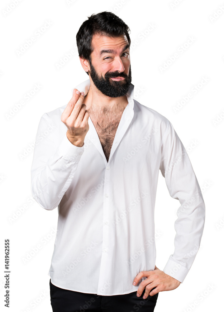 Handsome man with beard making money gesture
