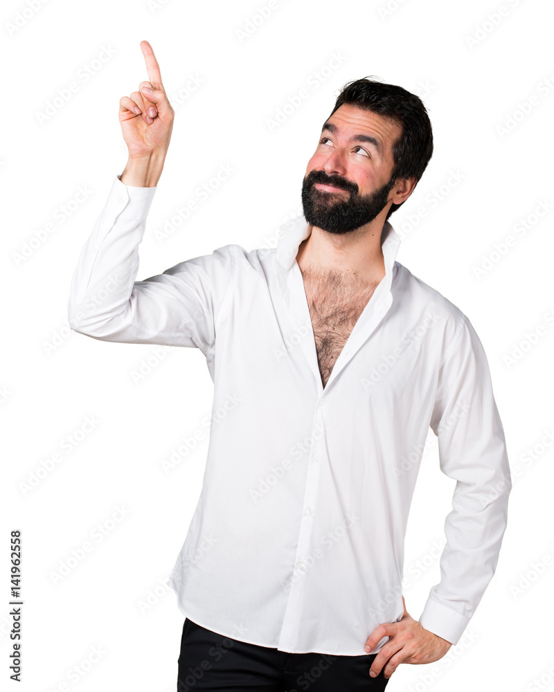 Handsome man with beard pointing up Handsome man with beard pointing up