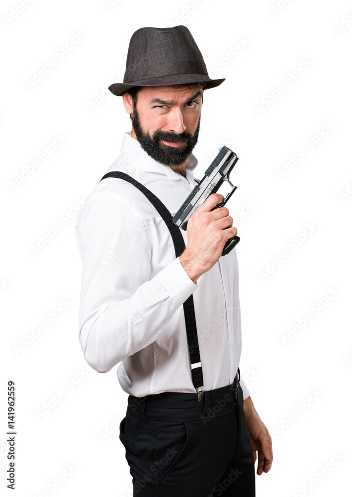 Hipster man with beard with a pistol Hipster man with beard with a pistol