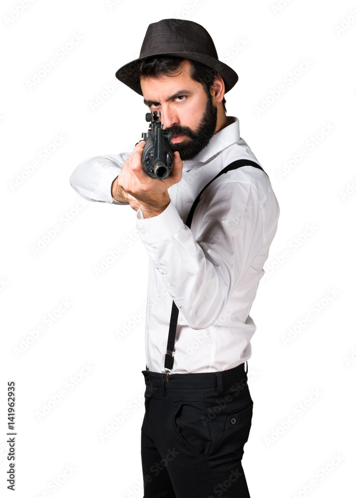 Hipster man with beard holding a rifle Hipster man with beard holding a rifle
