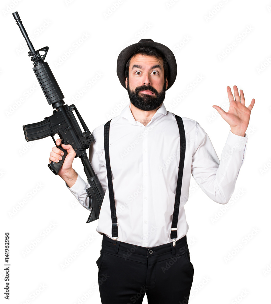 Hipster man with beard holding a rifle Hipster man with beard holding a rifle