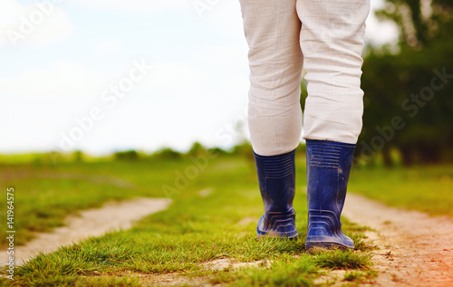 low view of farmer walking along the rural countryside road