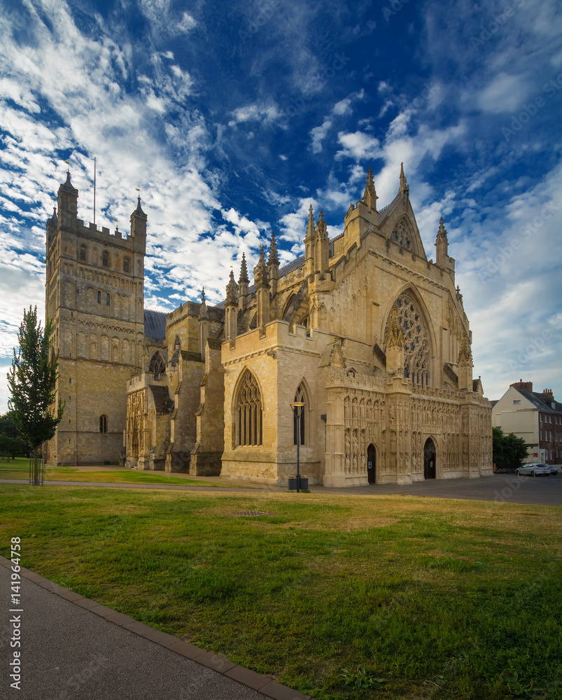 The cathedral in Exeter. Early morning. Cirrus clouds in the blue sky. Devon. England