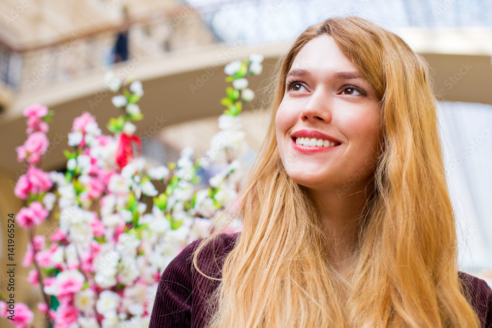 Spring mood. Young beautiful blonde woman, indoor market Spring mood. Young beautiful blonde woman, indoor market