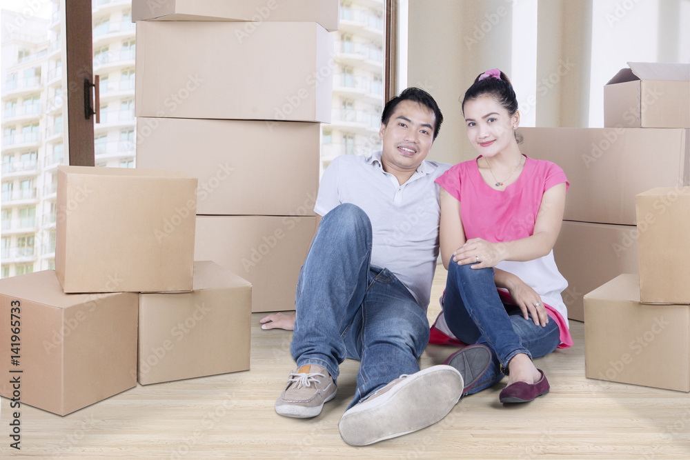 Romantic couple sitting with boxes Romantic couple sitting with boxes