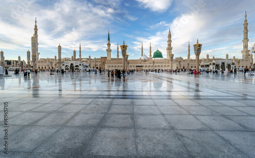 Muslims gathered for worship Nabawi Mosque, Medina, Saudi Arabia photo
