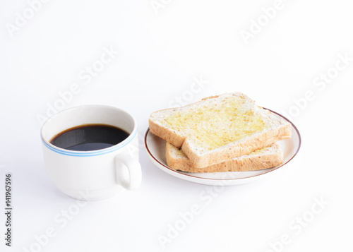 Coffee cup and sliced bread on white background