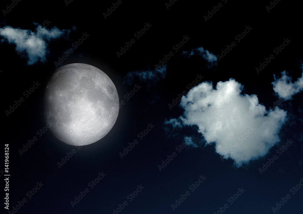 Obraz premium The moon in the night sky in clouds