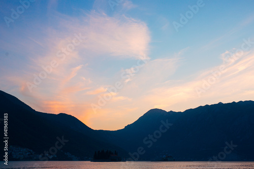 Sunset in the Bay of Kotor. Montenegrin sunsets. Sunset over the sea and the mountains.