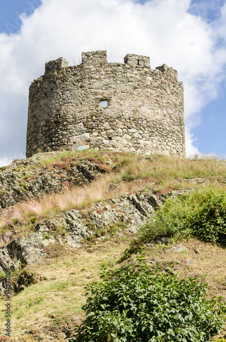 bottom view of the ruin of a medieval tower, Italy photo