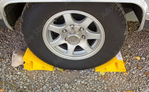 Yellow chock at the wheel