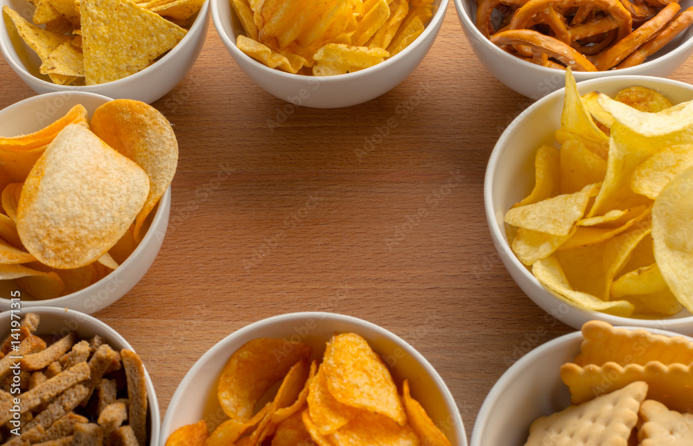 Pretzels in bowls on wooden table from above Pretzels in bowls on wooden table from above