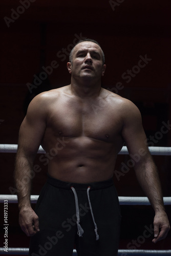 portrait of muscular professional kickboxer