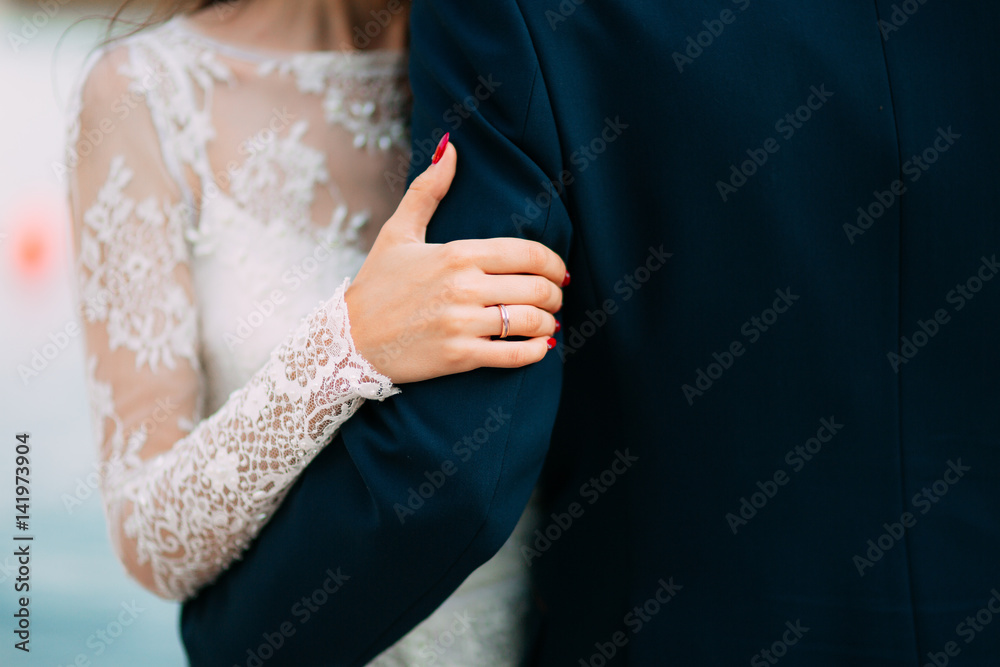 The hands of the newlyweds with rings. Wedding in Montenegro.