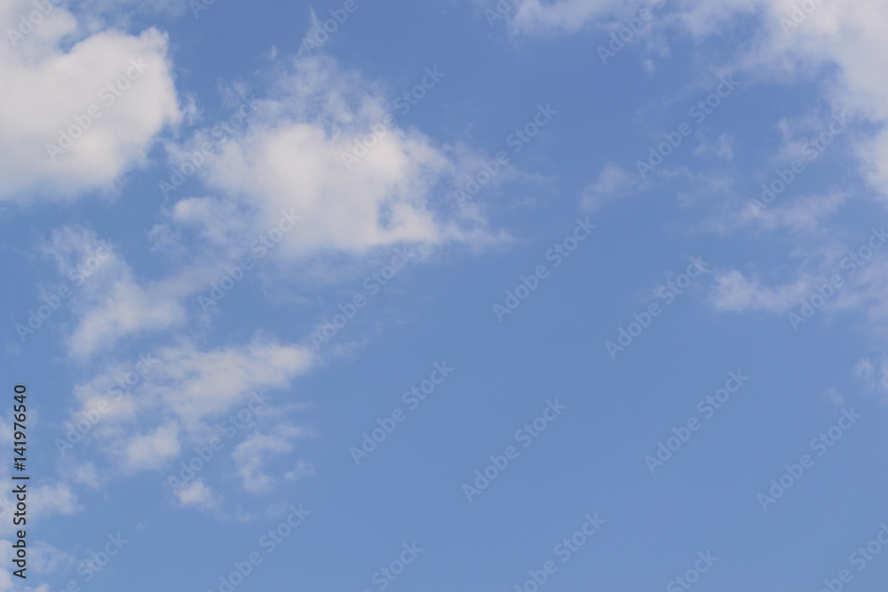 White fluffy clouds in blue sky and copyspace for backgrounds White fluffy clouds in blue sky and copyspace for backgrounds