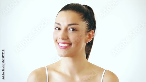 Close up portrait of beautiful woman with makeup smiling and sending kisses to camera