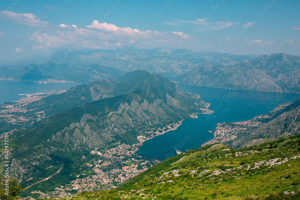 Bay of Kotor from the heights. View from Mount Lovcen to the bay. View down from the observation platform on the mountain Lovcen. Mountains and bay in Montenegro. The liner near the old town of Kotor.