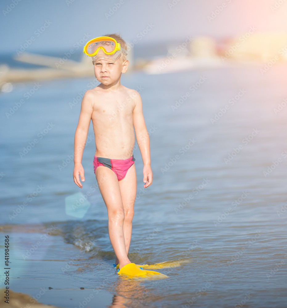 Little boy with snorkel by the sea. Cute little kid wearing mask and  flippers for diving at sand tropical beach. Ocean coast. Stock Photo |  Adobe Stock