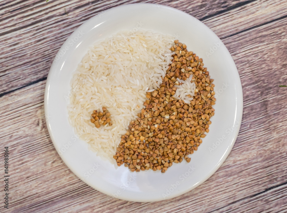 Rice and buckwheat one on a white plate Rice and buckwheat one on a white plate