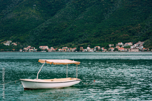 Wooden boats on the water. In the Bay of Kotor in Montenegro. Marine boats. © Nadtochiy