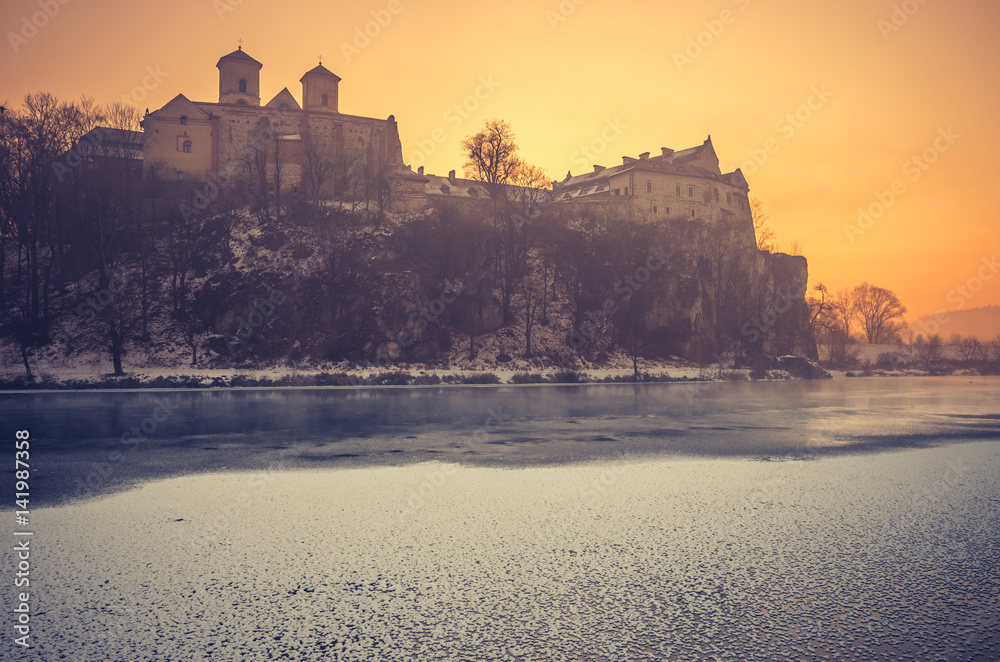 Krakow, Poland, Tyniec abbey in the morning over frozen Vistula river,