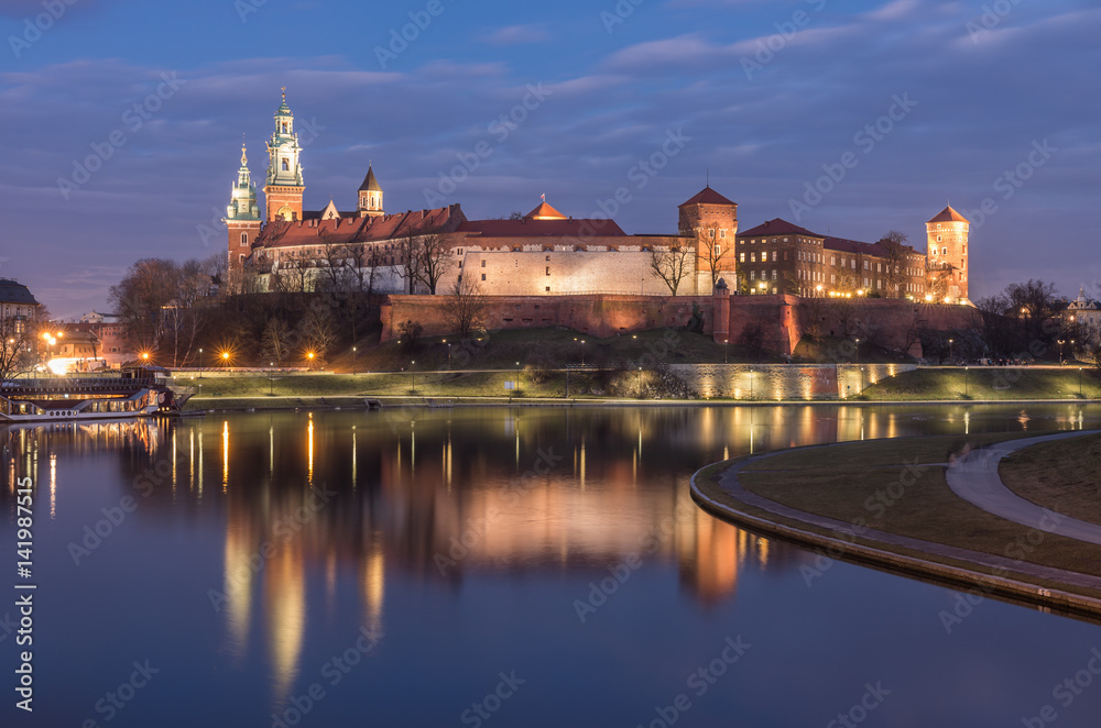Krakow, Poland, Wawel Castle and Wawel cathedral over Vistula river in the night