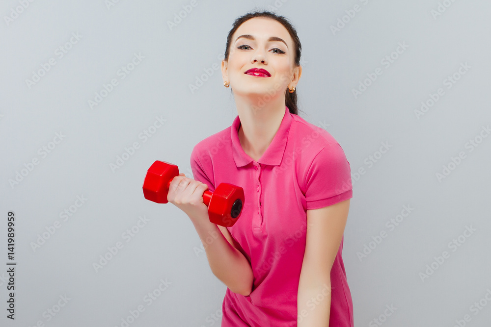 Young happy smiling woman in sportswear. Girl is pretty and fashion Young happy smiling woman in sportswear. Girl is pretty and fashion