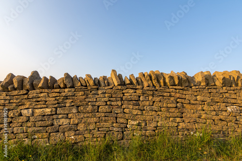 Country side Cotswold stone wall.