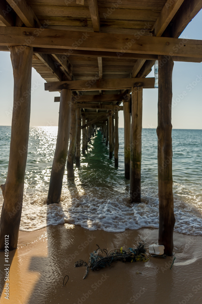 View from underneath a wooden pier. View from underneath a wooden pier.