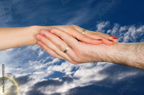 Hands of lovers, men and women in the sky. Romantic art image for cards