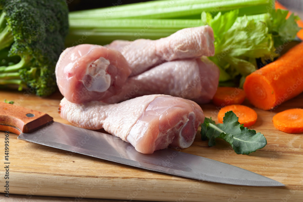 raw vegetables with chicken drumsticks raw vegetables with chicken drumsticks