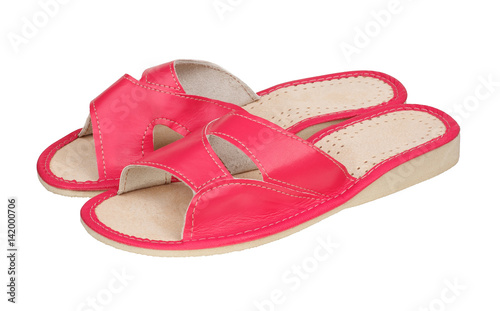 Pink slippers made of leather isolated on white background