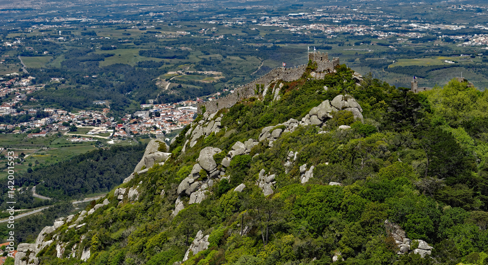 View from Palacio Pena of the adjacent ruins of the Castle of the Moors, standing on a mountaintop above the popular town of Sintra, Portugal View from Palacio Pena of the adjacent ruins of the Castle of the Moors, standing on a mountaintop above the popular town of Sintra, Portugal