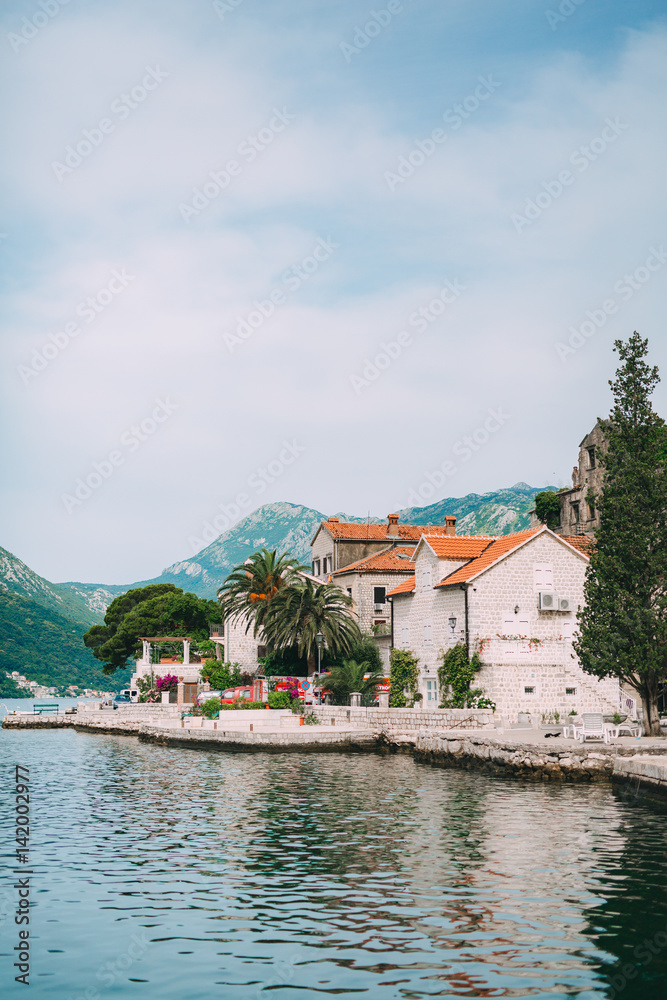 The old town of Perast on the shore of Kotor Bay, Montenegro. The ancient architecture of the Adriatic and the Balkans. Fishermen's cities of Europe.