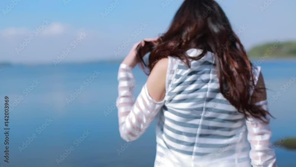 Portrait Of Attractive Girl With Long Hair Posing On Rocky Beach Portrait Of Attractive Girl With Long Hair Posing On Rocky Beach