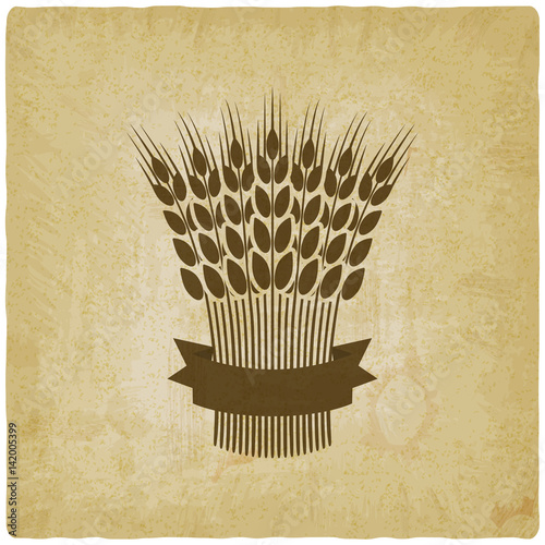 sheaf of wheat with ribbon vintage background