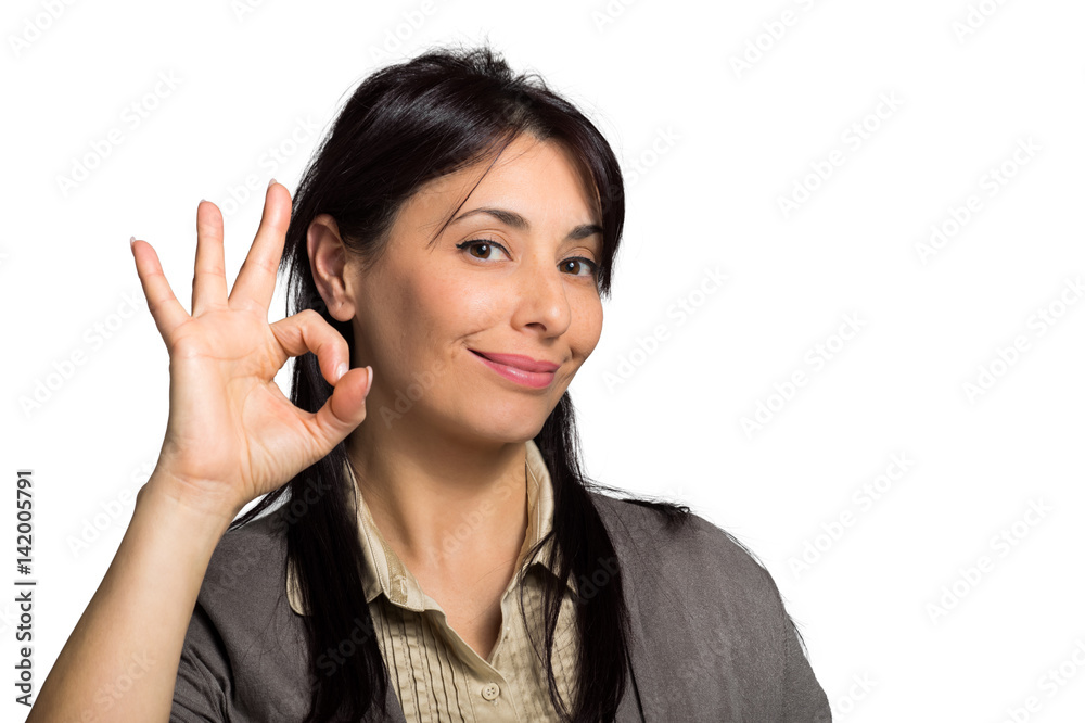 Portrait of beautiful girl showing OK sign and smiling Portrait of beautiful girl showing OK sign and smiling