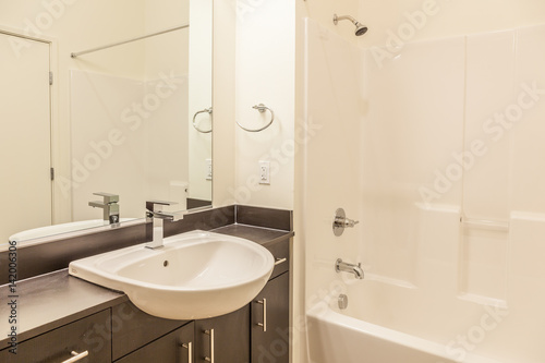 small space modern white bathroom with overhanging sink