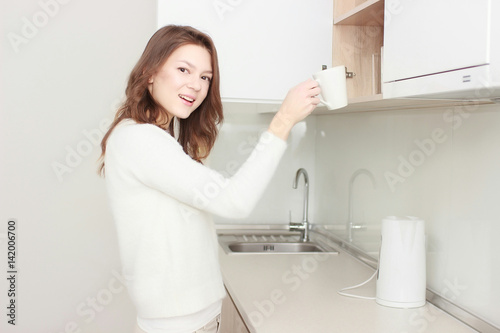 Pretty girl preparing tea