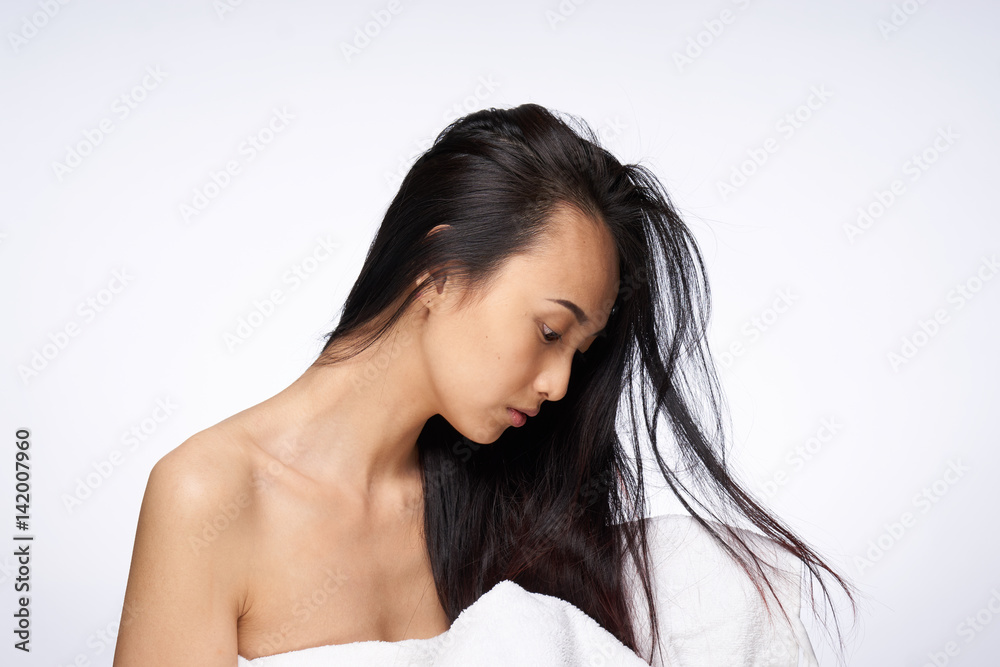 Fototapeta premium beautiful brunette with long hair and bare shoulders