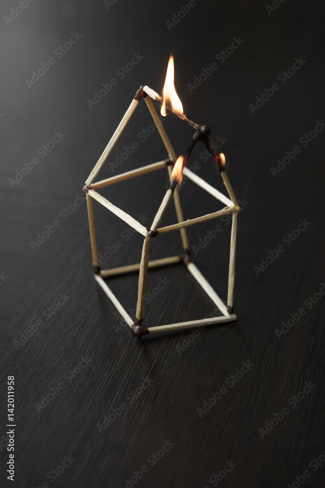 close up burned matchstick house close up burned matchstick house